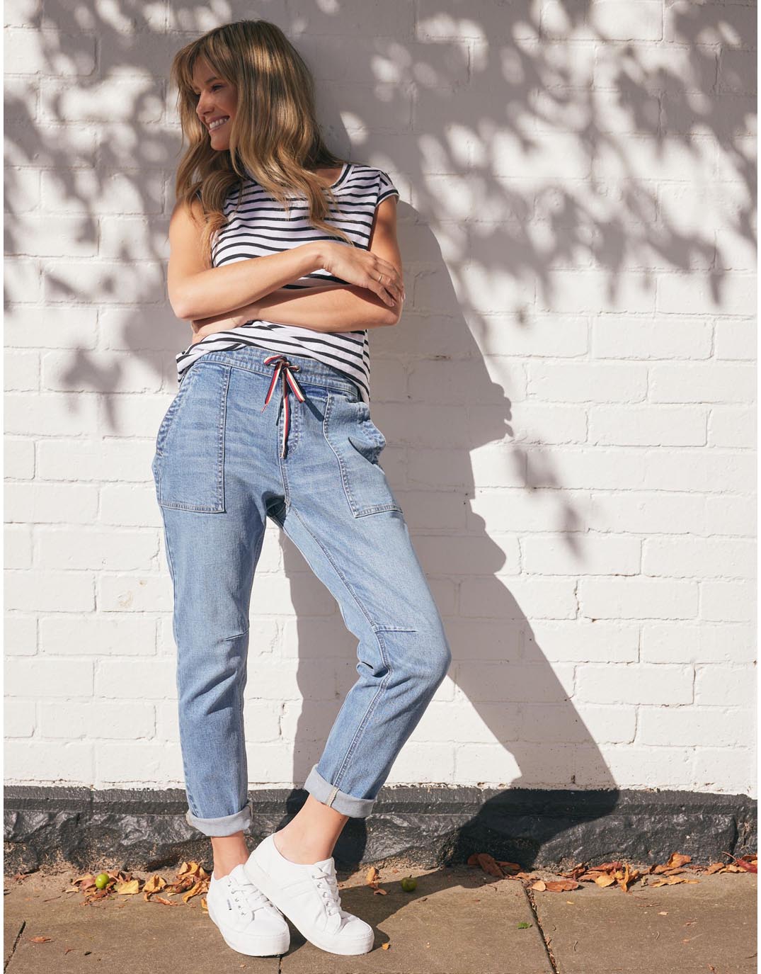 white-co-cara-raw-hem-denim-jogger_mid-wash-womens-clothing